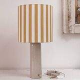 Sandstone lamp and striped lampshade