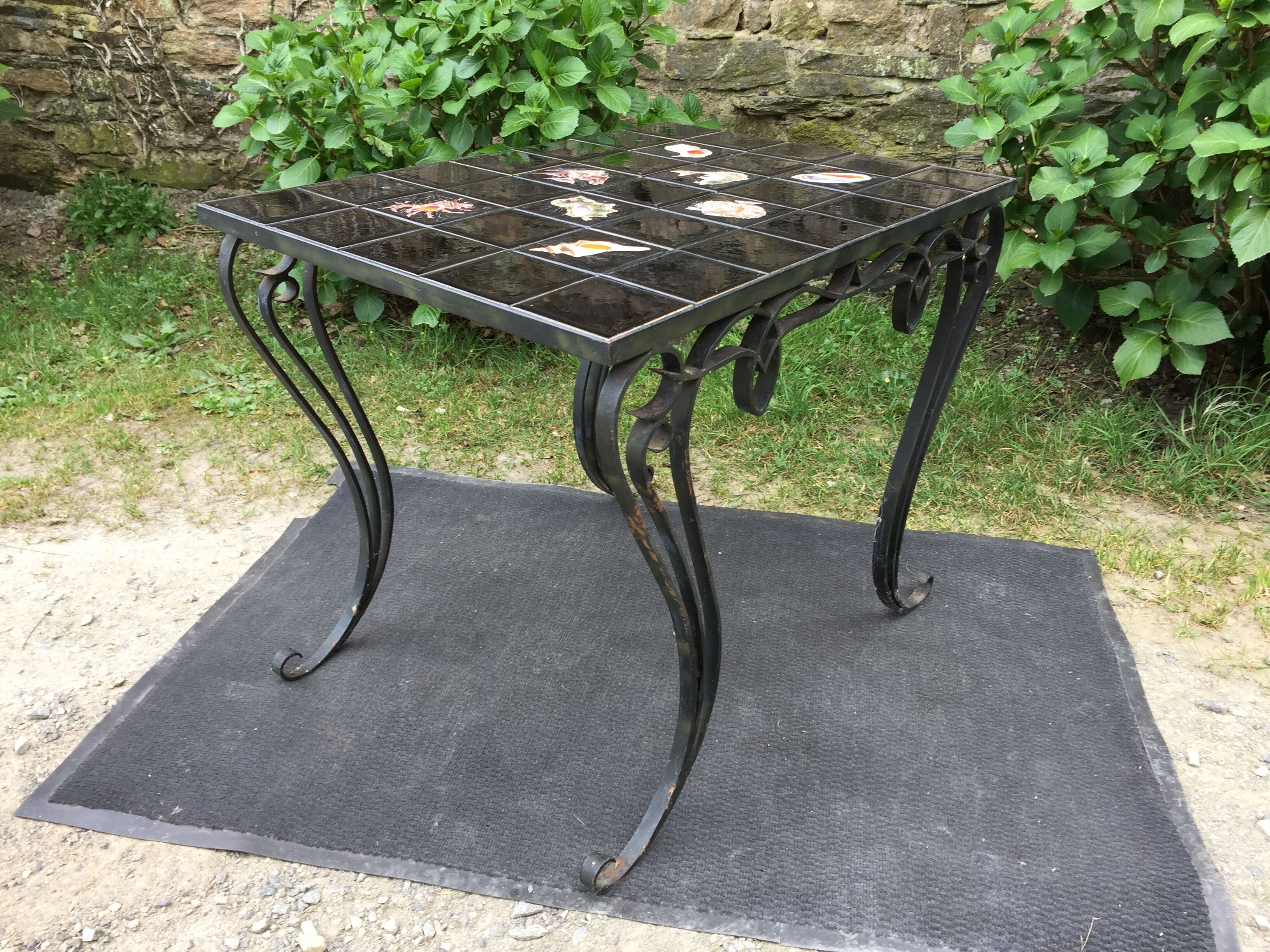 Vintage ceramic coffee table by Guy Trévoux with wrought iron base.