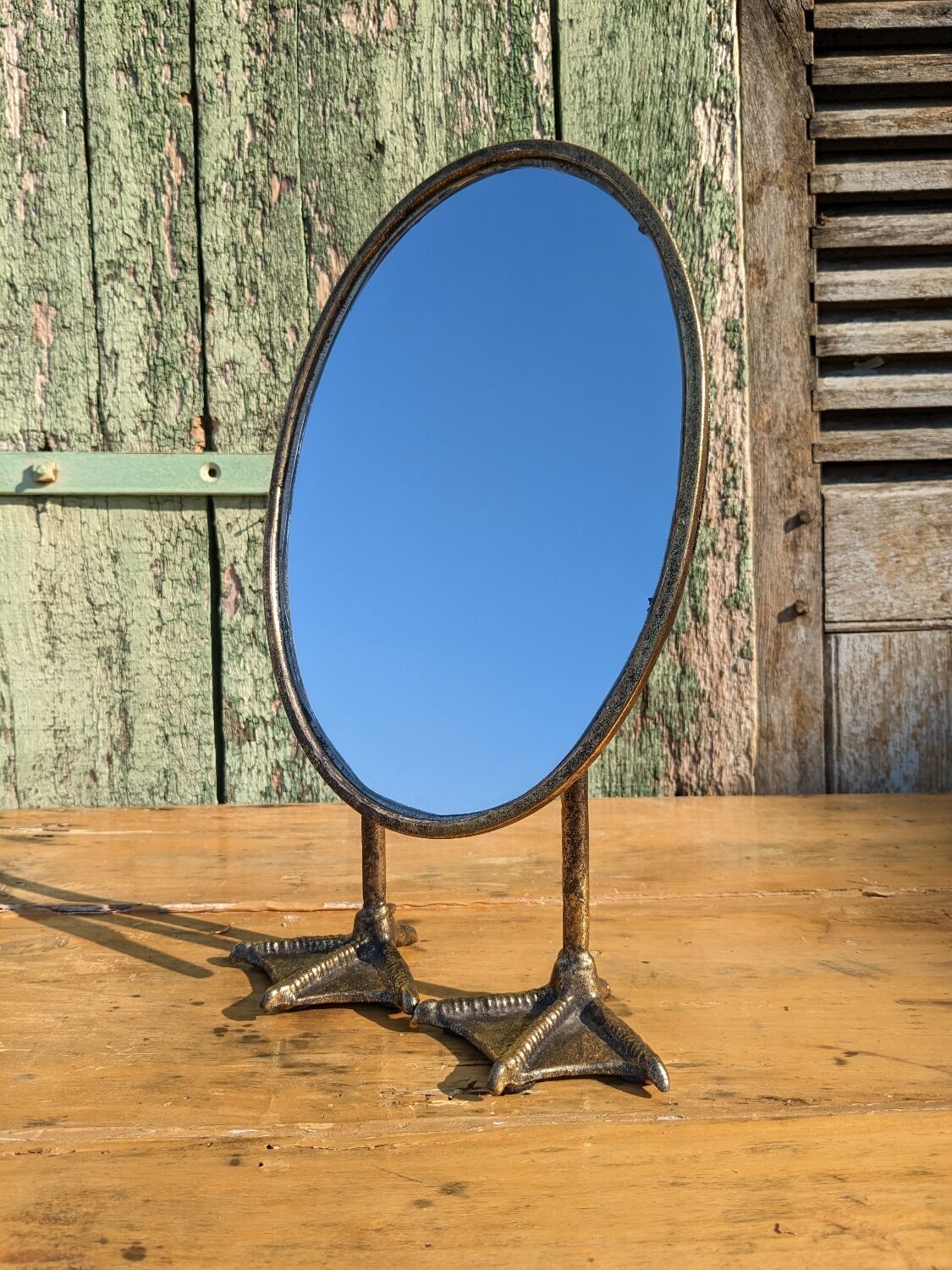 Metal mirror with duck legs