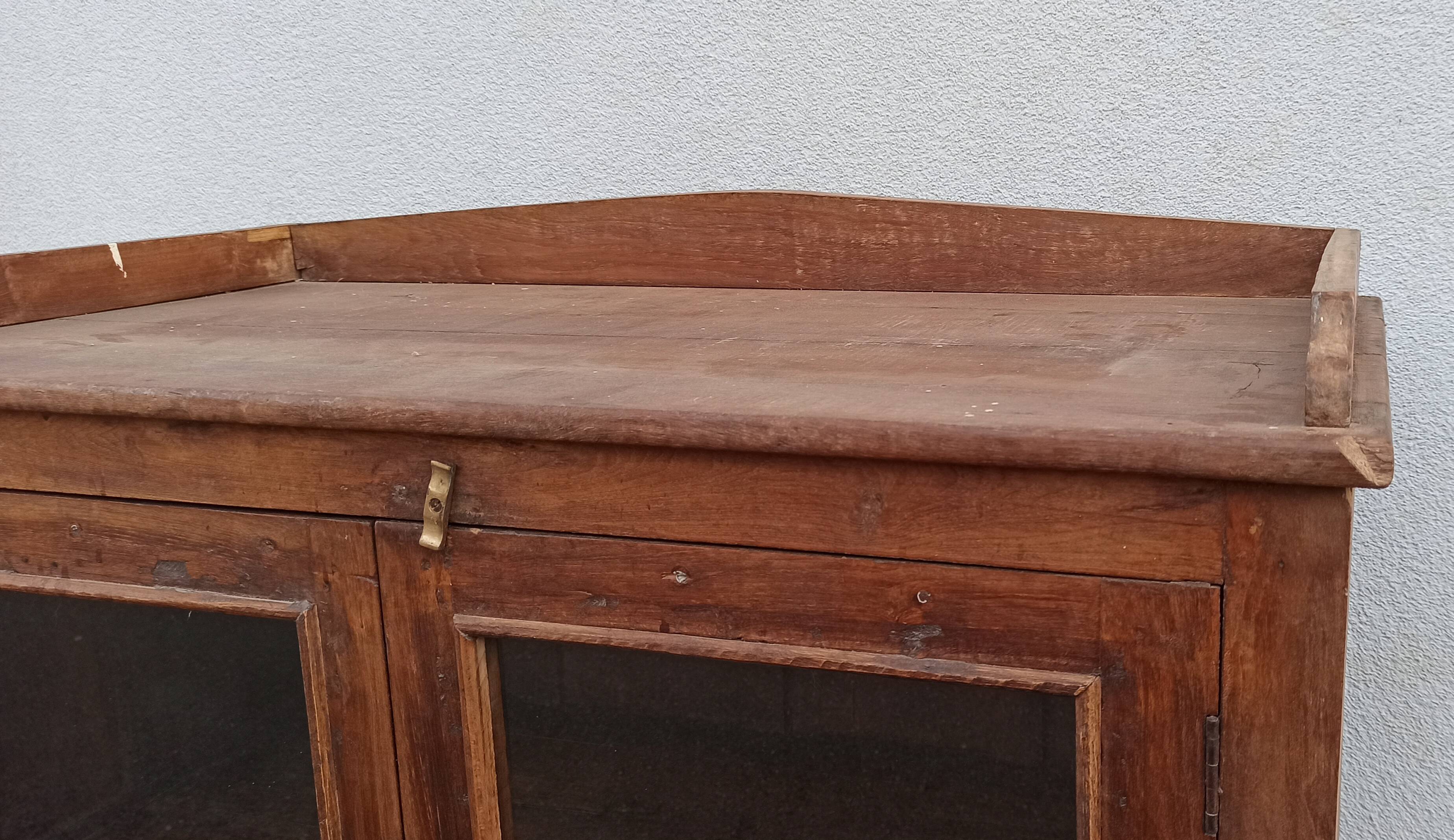 Old wooden glazed cabinet with four doors