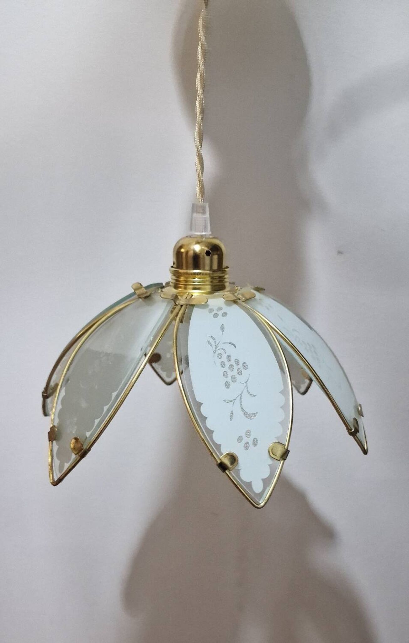 Glass flower rimmed with brass