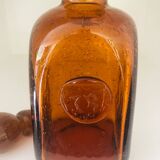 Carafe  ancienne en verre de Biot ambré et bullé, cachet 1496.