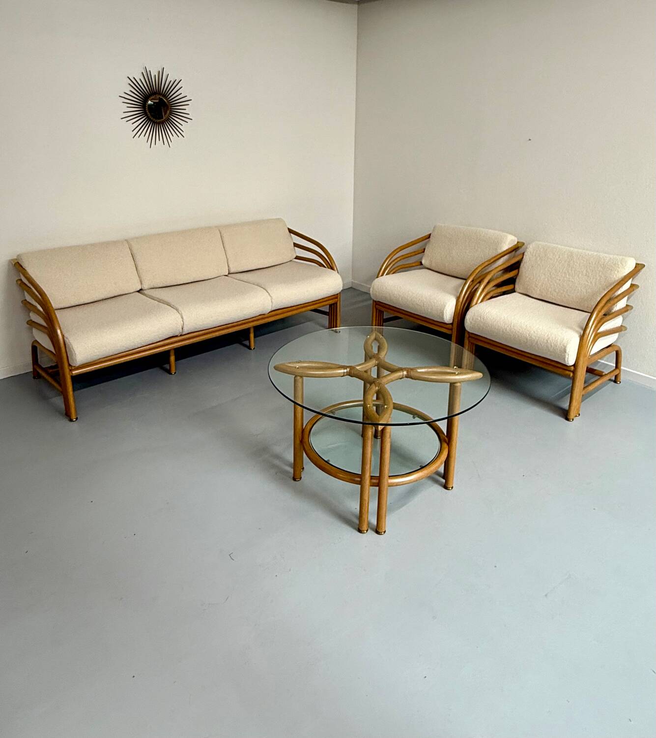 Complete living room with rattan sofa and white bouclette, brass finish, 80's design