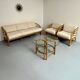 Complete living room with rattan sofa and white bouclette, brass finish, 80's design