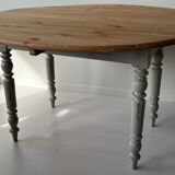 Round wooden table with flaps