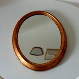 Antique oval mirror in gilded solid wood