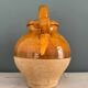 Old terracotta gargoulette jug