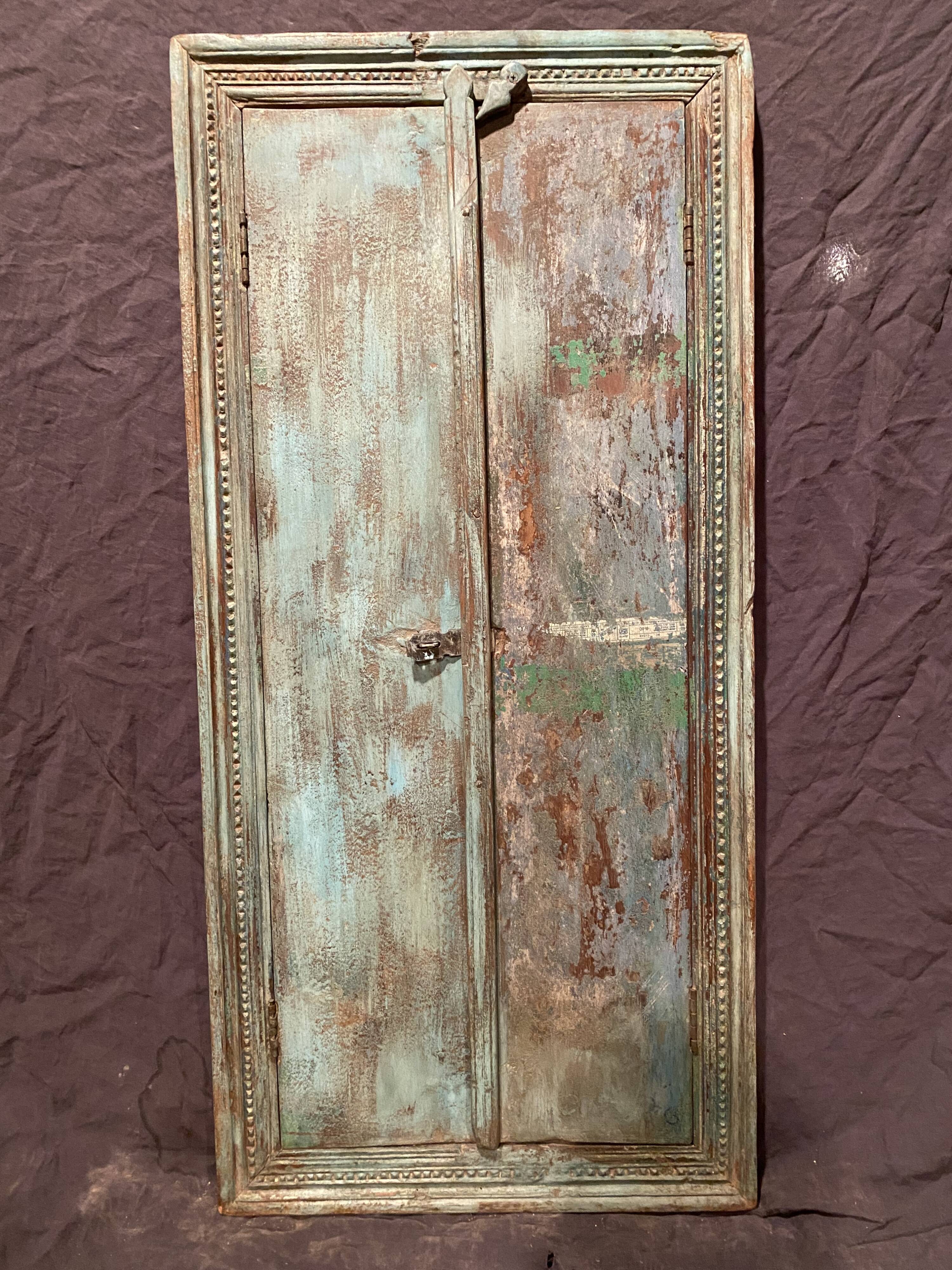 Old Indian window in blue lacquered wood