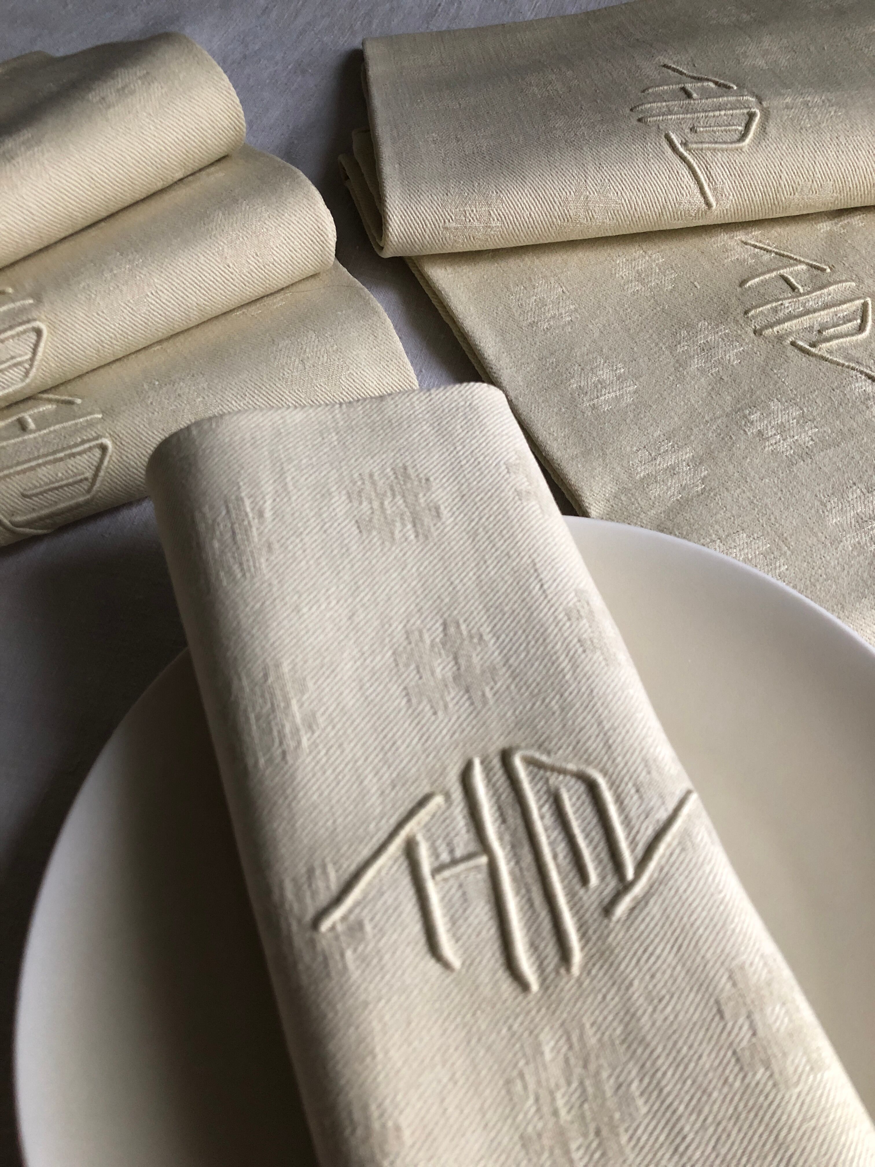 Antique napkins damascus and monogrammed tinted fresh butter