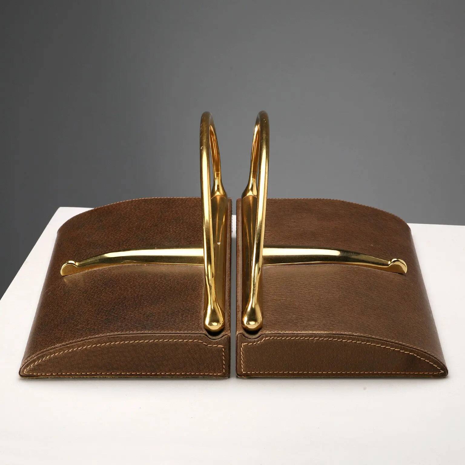 Vintage Gucci bookends in leather and brass, Italy, 1970s.