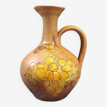 Vintage stoneware pitcher with grape patterns