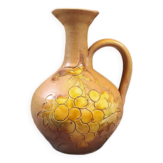 Vintage stoneware pitcher with grape patterns
