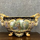 Earthenware planter with polychrome enamelled decoration on a blue background