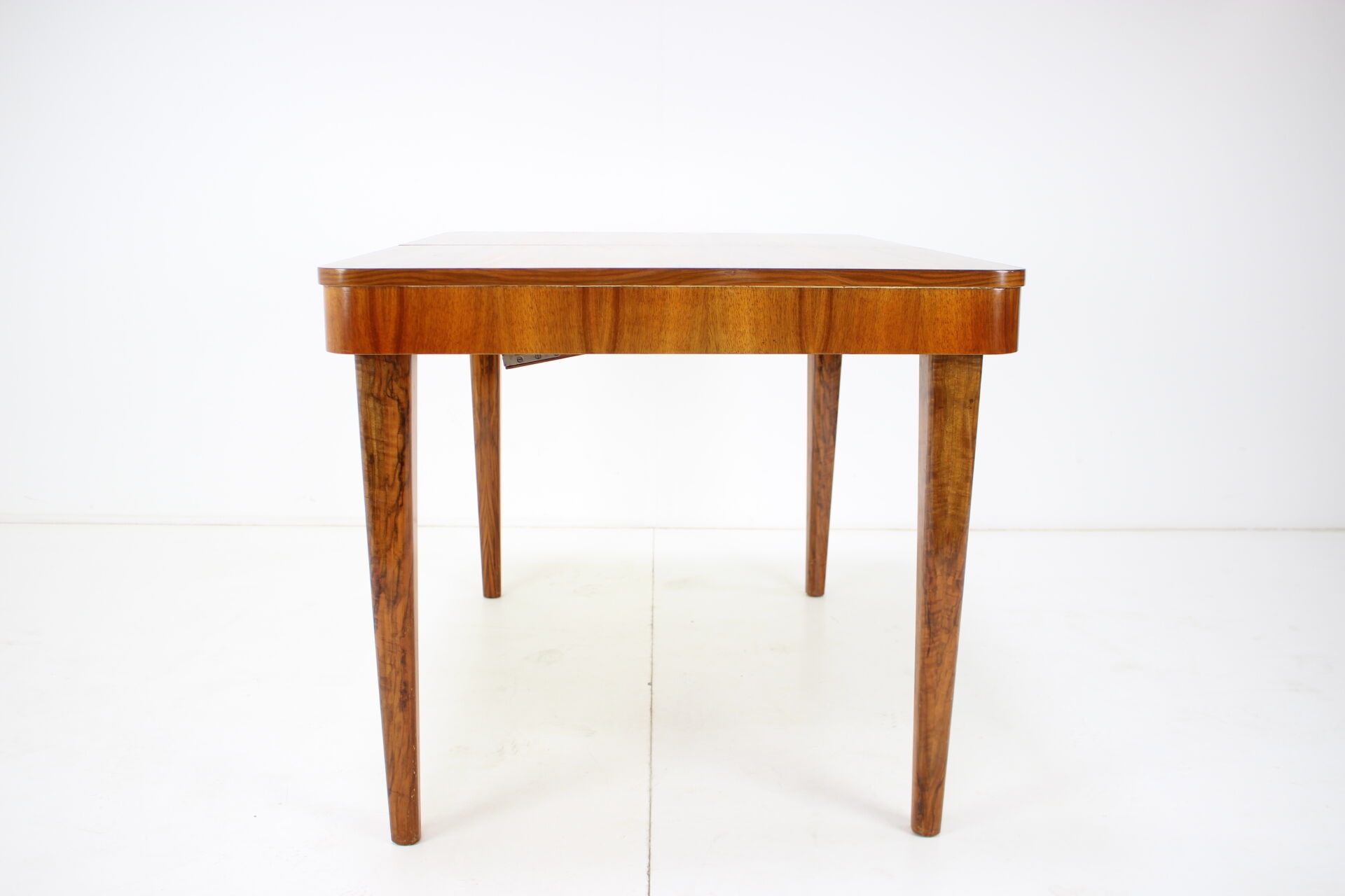 Extendable dining table designed by Jindřich Halabala for UP Závody, 1957.