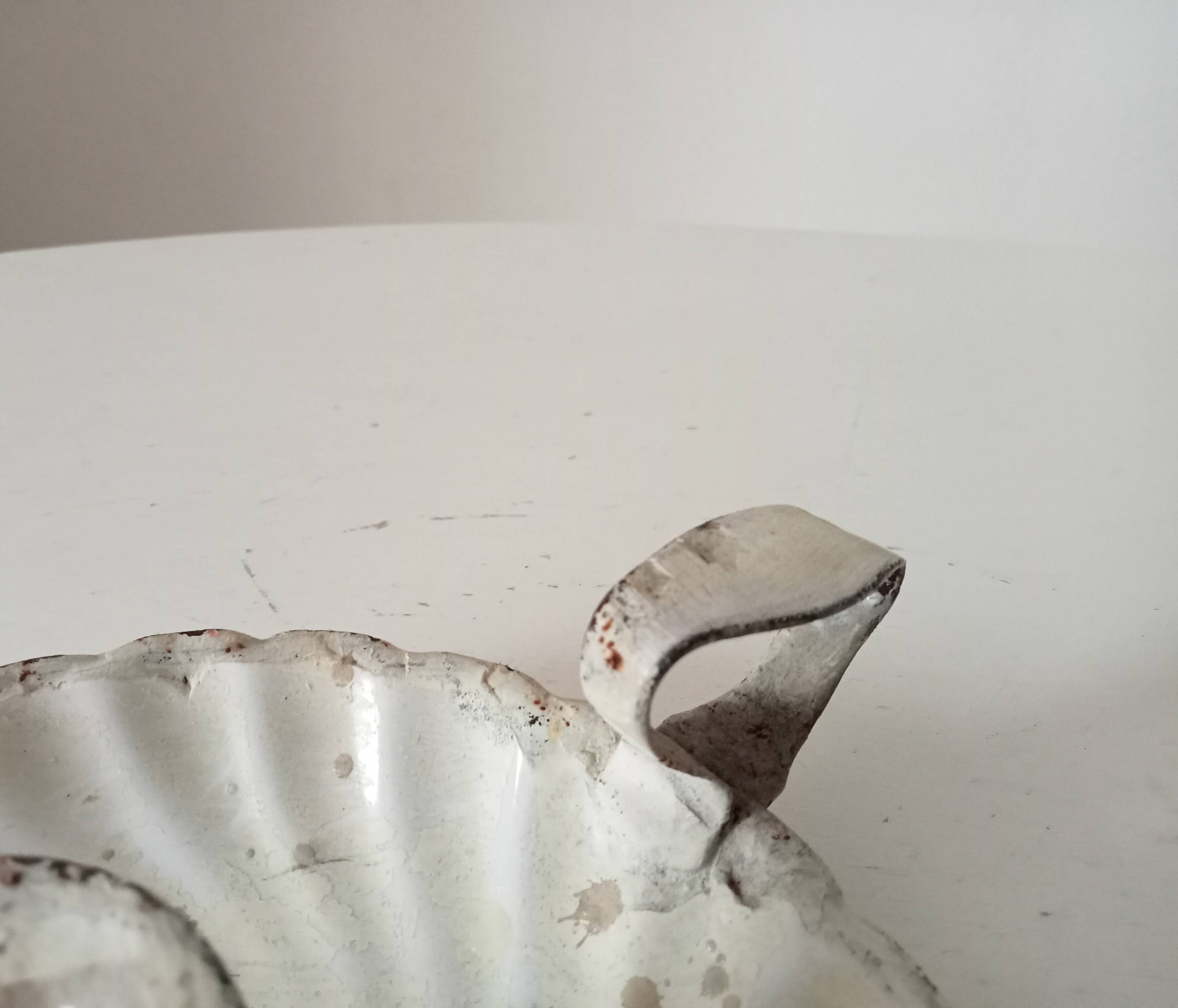 Antique hand candle holder "cellar rat" in enamelled metal