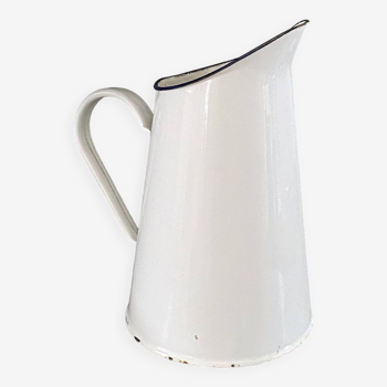 Old white enameled pitcher