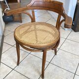 Bistro chair with a curved wooden frame and caned seat from the 1930s.