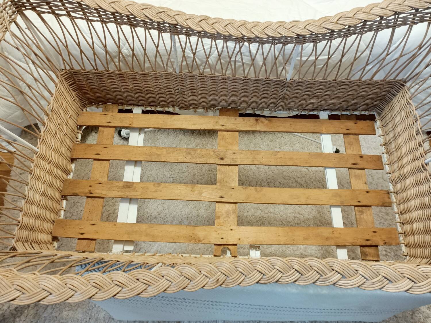 Rattan and wrought iron cradle