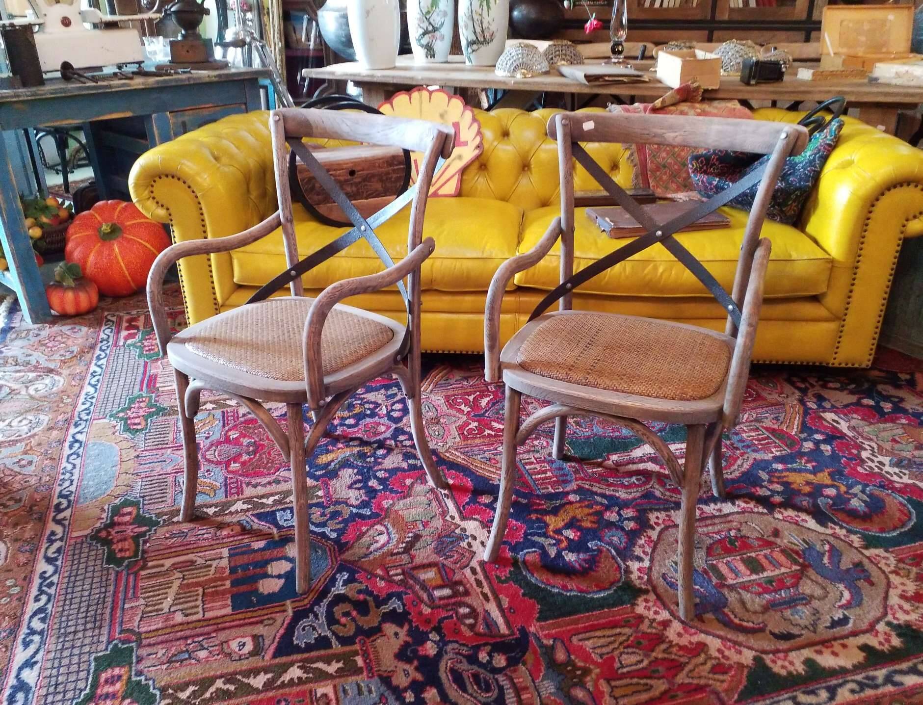 Angled wooden armchairs