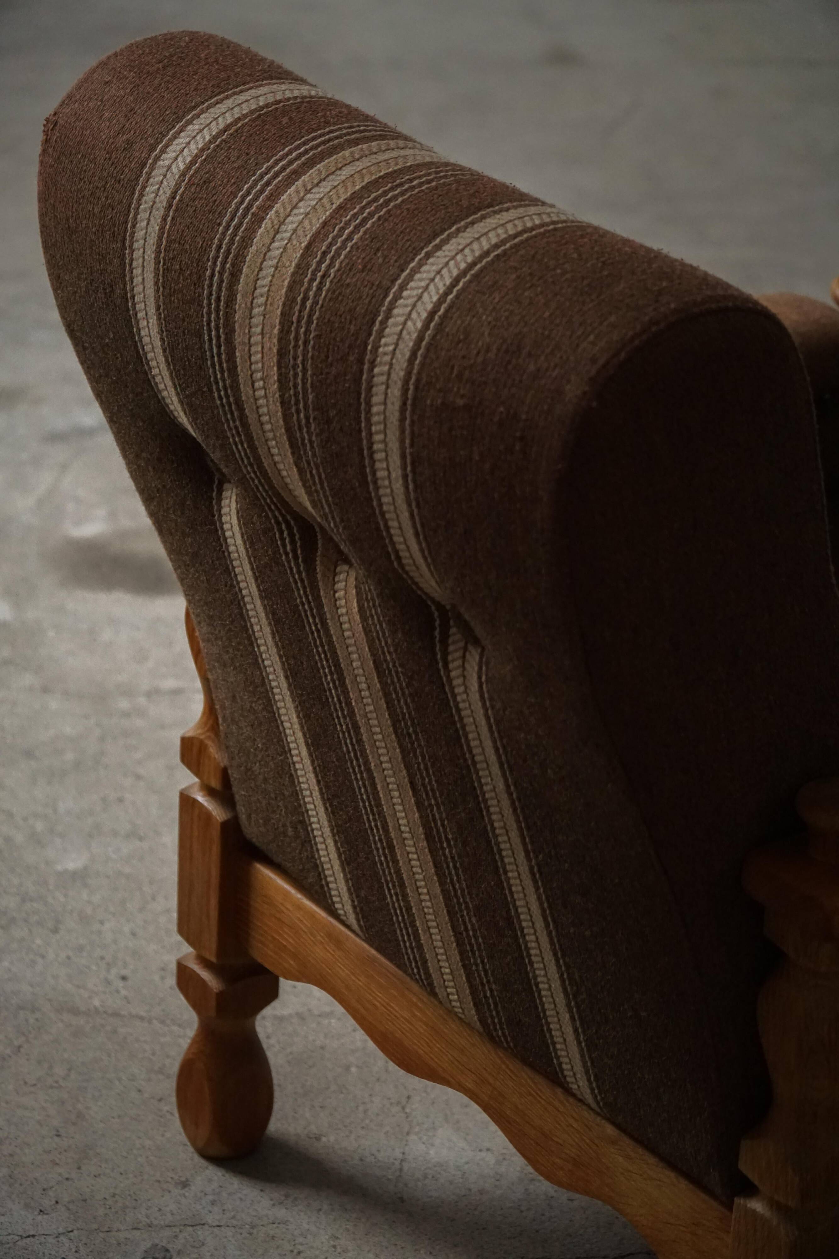 Modern Danish, a pair of lounge chairs in oak and wool, Henning Kjærnulf, 1960s.