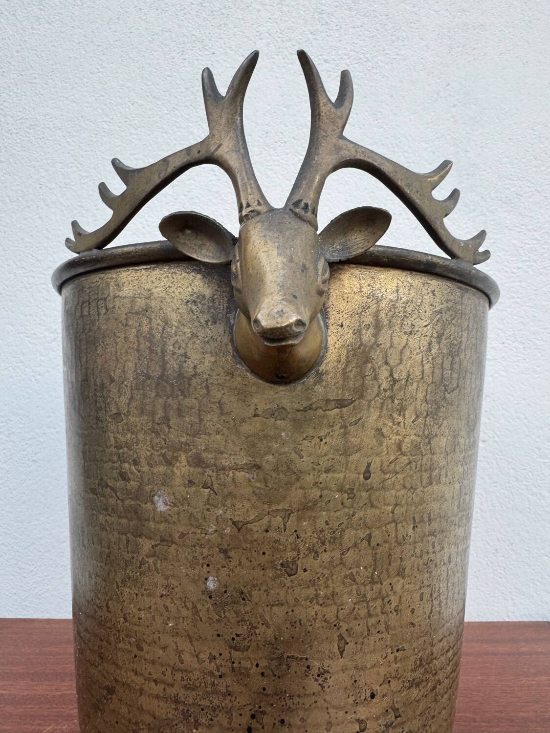 Antique champagne cooler with stag heads