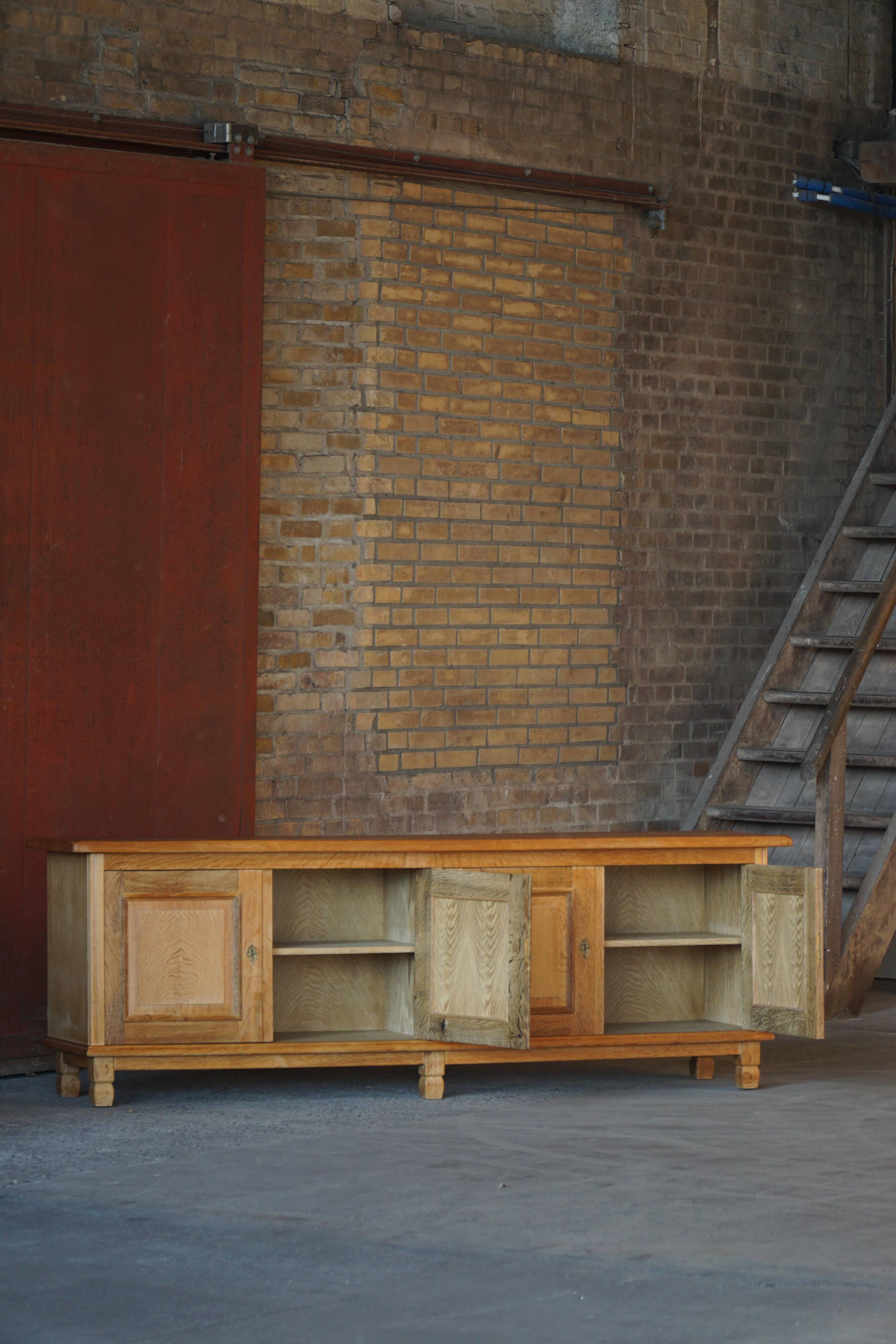Modern Danish low enfilade in oak with panelled doors, mid-20th century.
