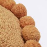 Mini round cushion with ochre wool pompoms