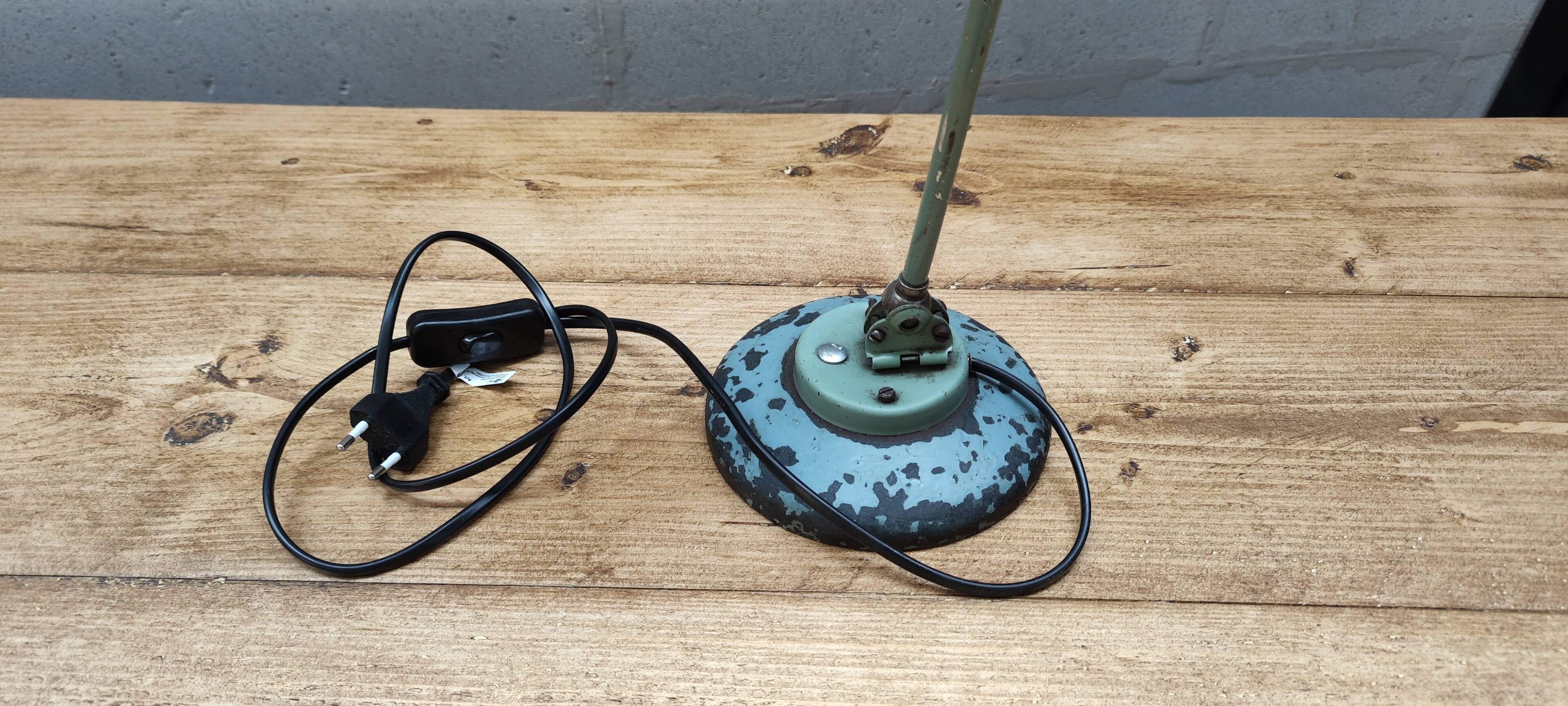 Old green industrial desk lamp