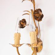 Vintage wall light in gold metal with flower and leaf decoration