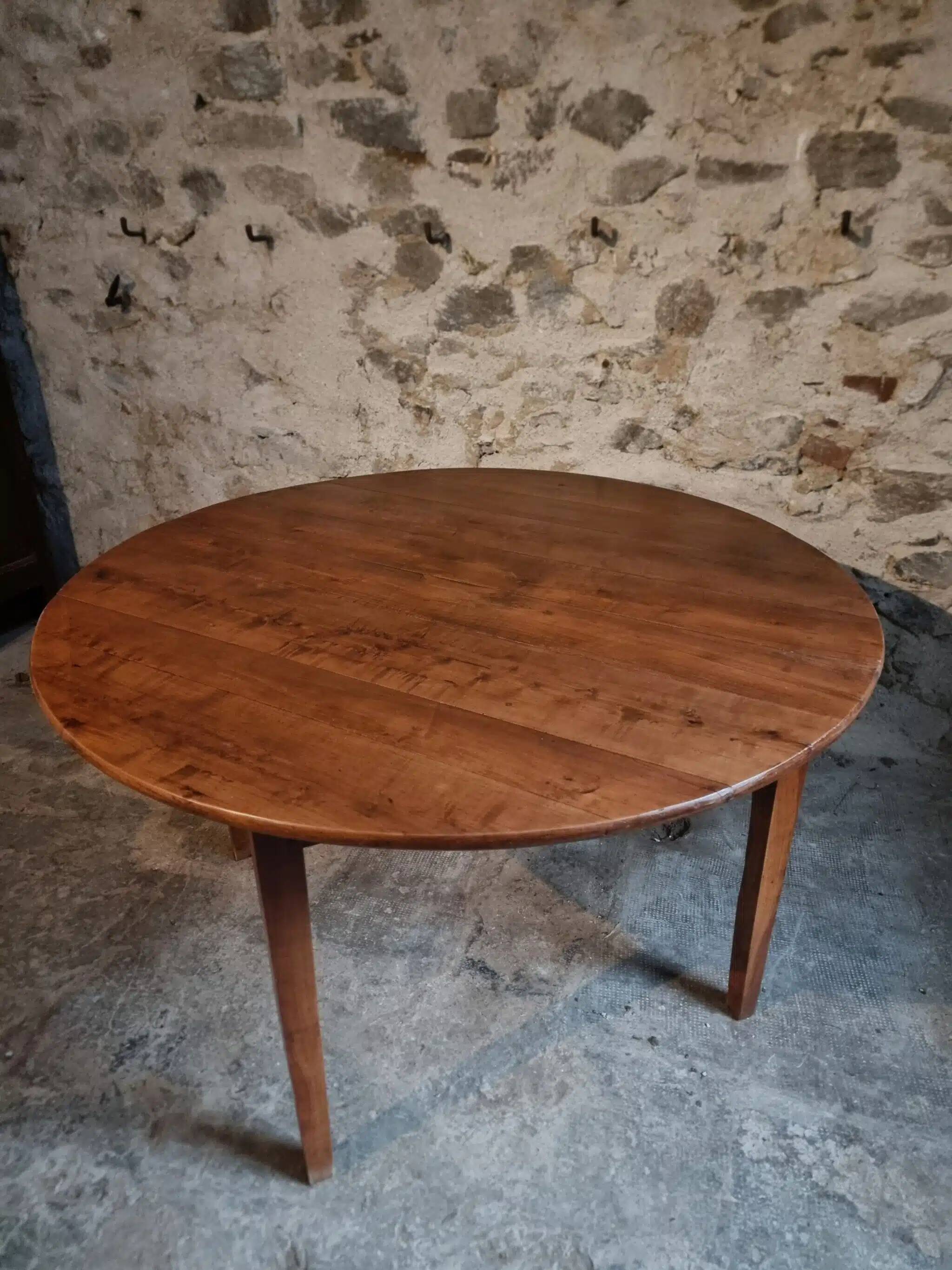 Antique round dining table in cherry wood, France, circa 1920.