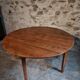 Antique round dining table in cherry wood, France, circa 1920.