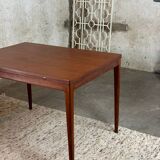 Extendable teak and teak veneer dining table