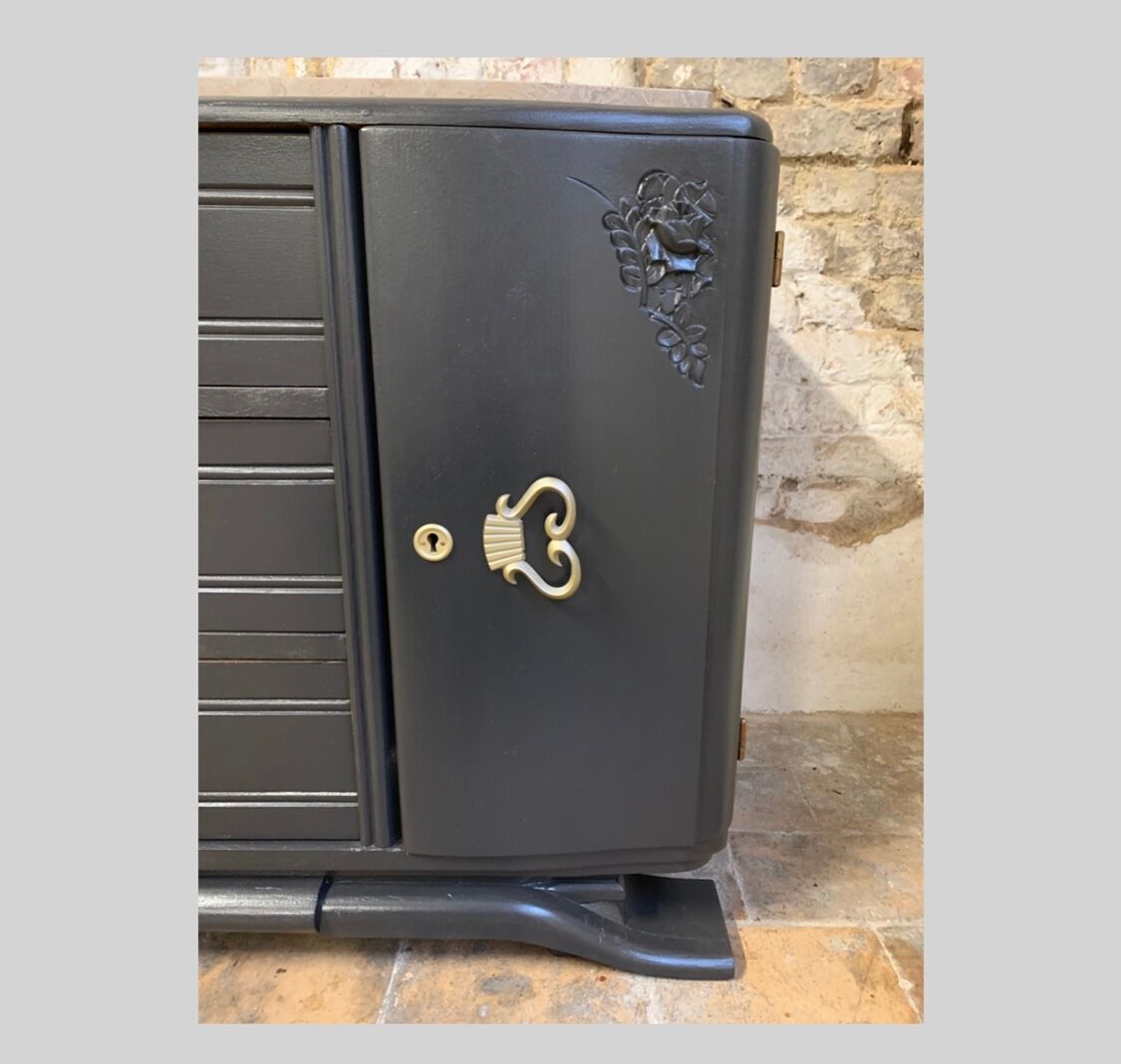 Black art deco sideboard and grey marble