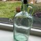 Green pitcher made of vintage glass
