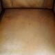 Luxurious cowhide Art Deco design armchair with wooden armrests and cognac-colored leather