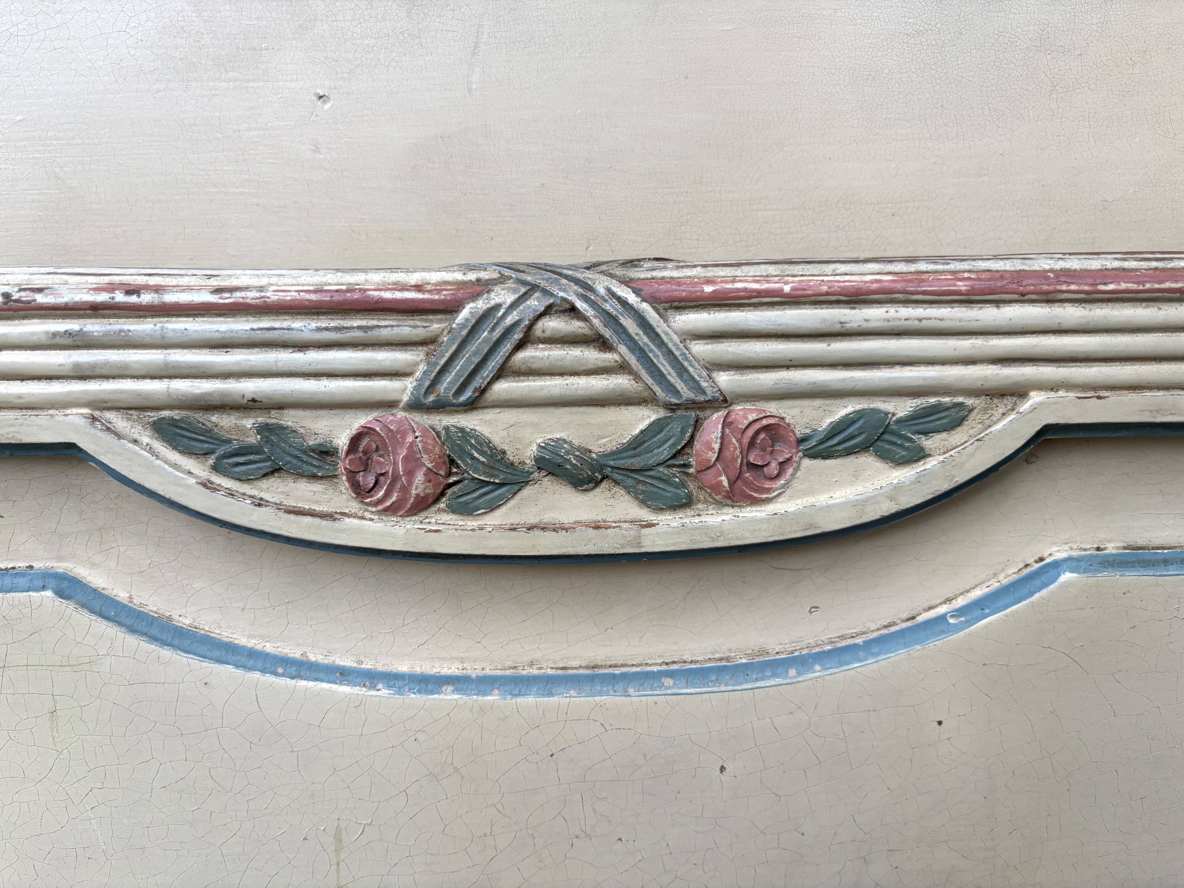 Carved and painted wooden bed