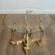 Coffee table model with cranes surrounding a brass bonsai and round glass top by Willy Daro.
