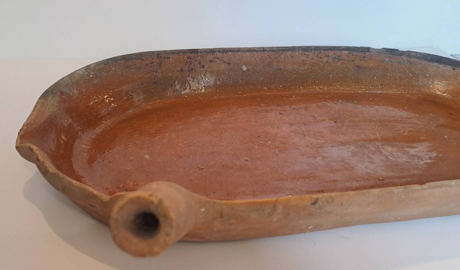 Old glazed terracotta frying pan from the 19th century.