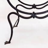 Curule armchair in wrought iron and leather