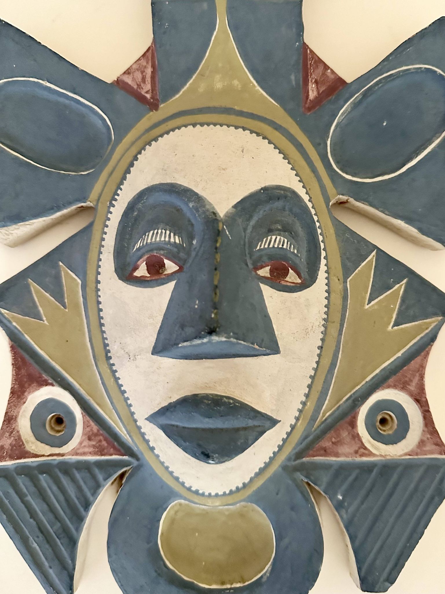 Painted terracotta wall mask