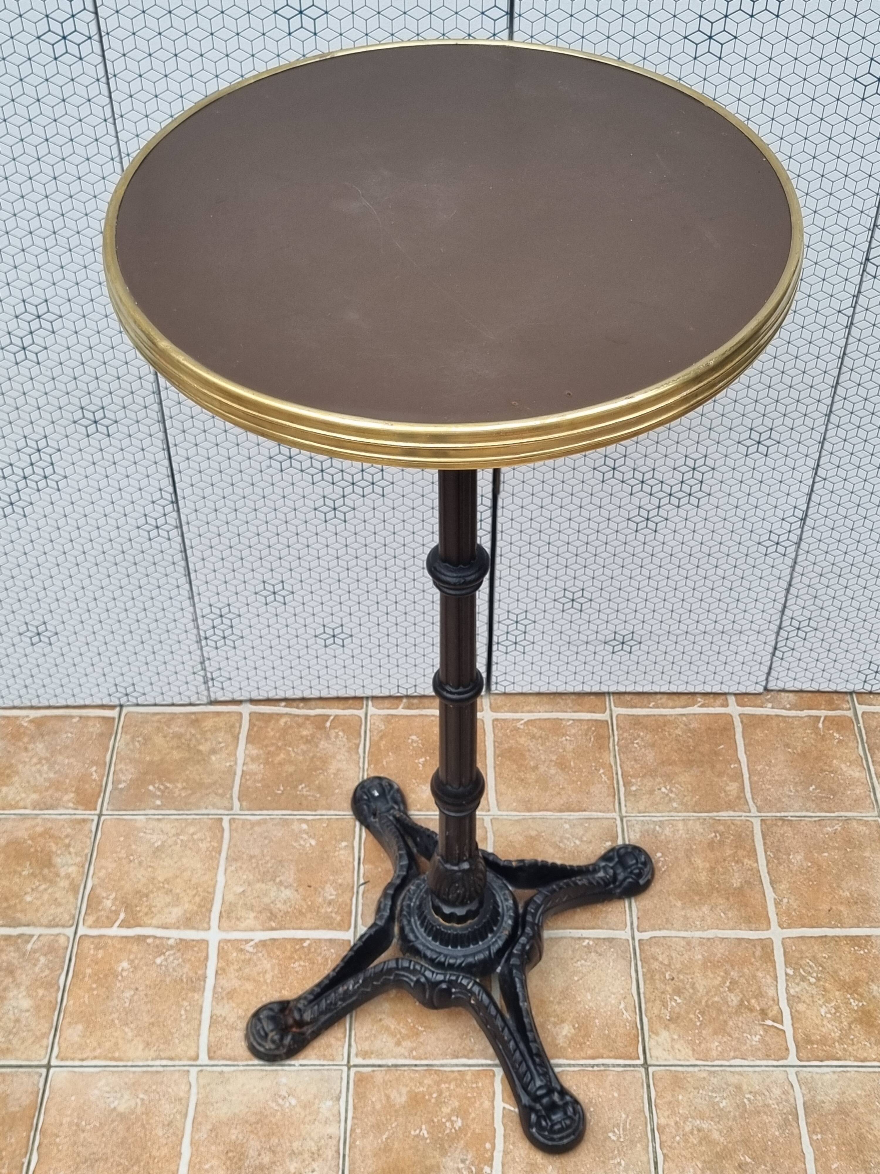 Vintage cast iron and brass "standing" bistro table, 109 cm