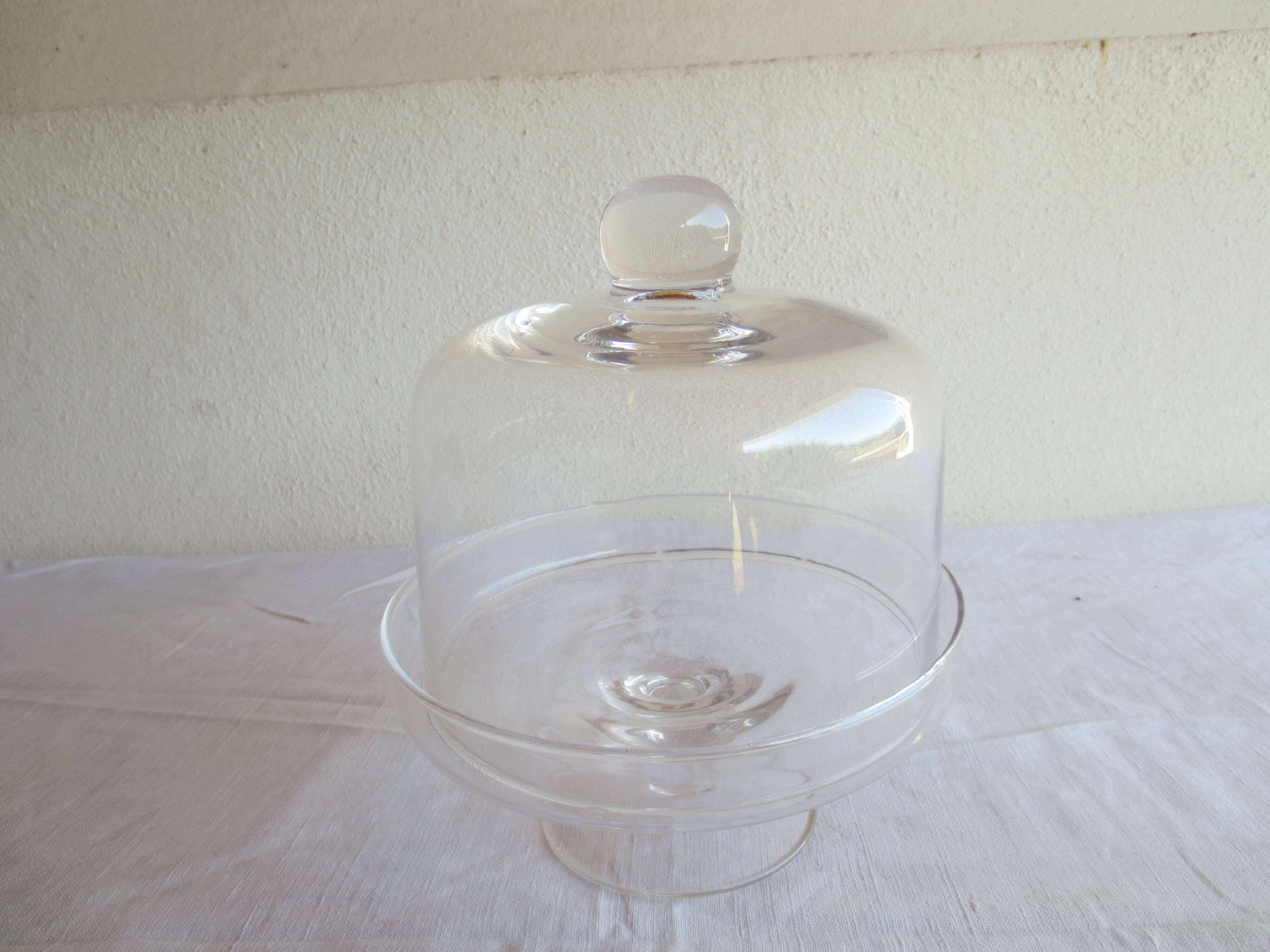 Old glass cake dome on a stand