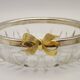 Set of 2 glass and metal bowls with a bow design.
