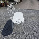 Old garden bench in solid wrought iron