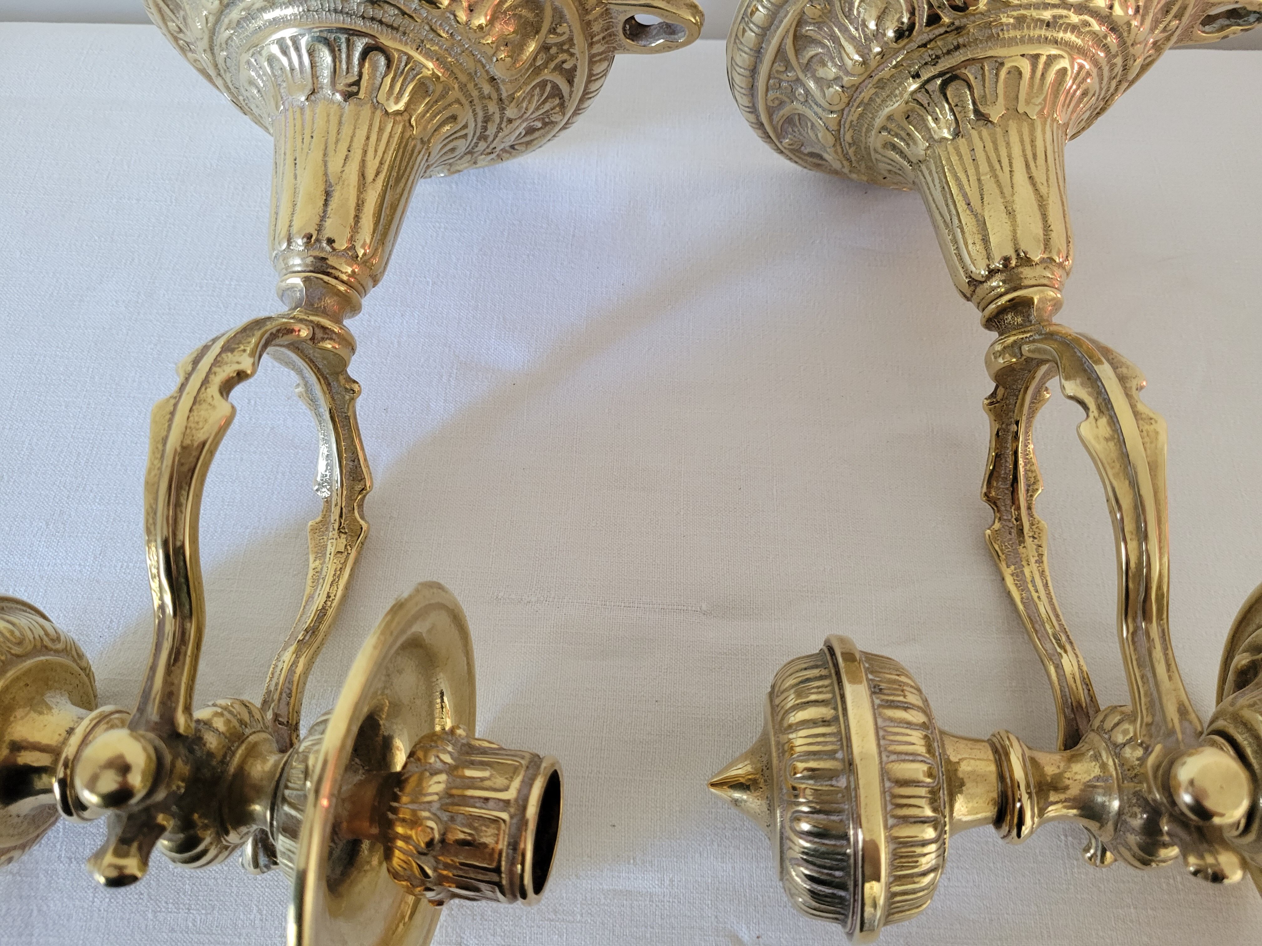 Duo of brass balance wall candle holders