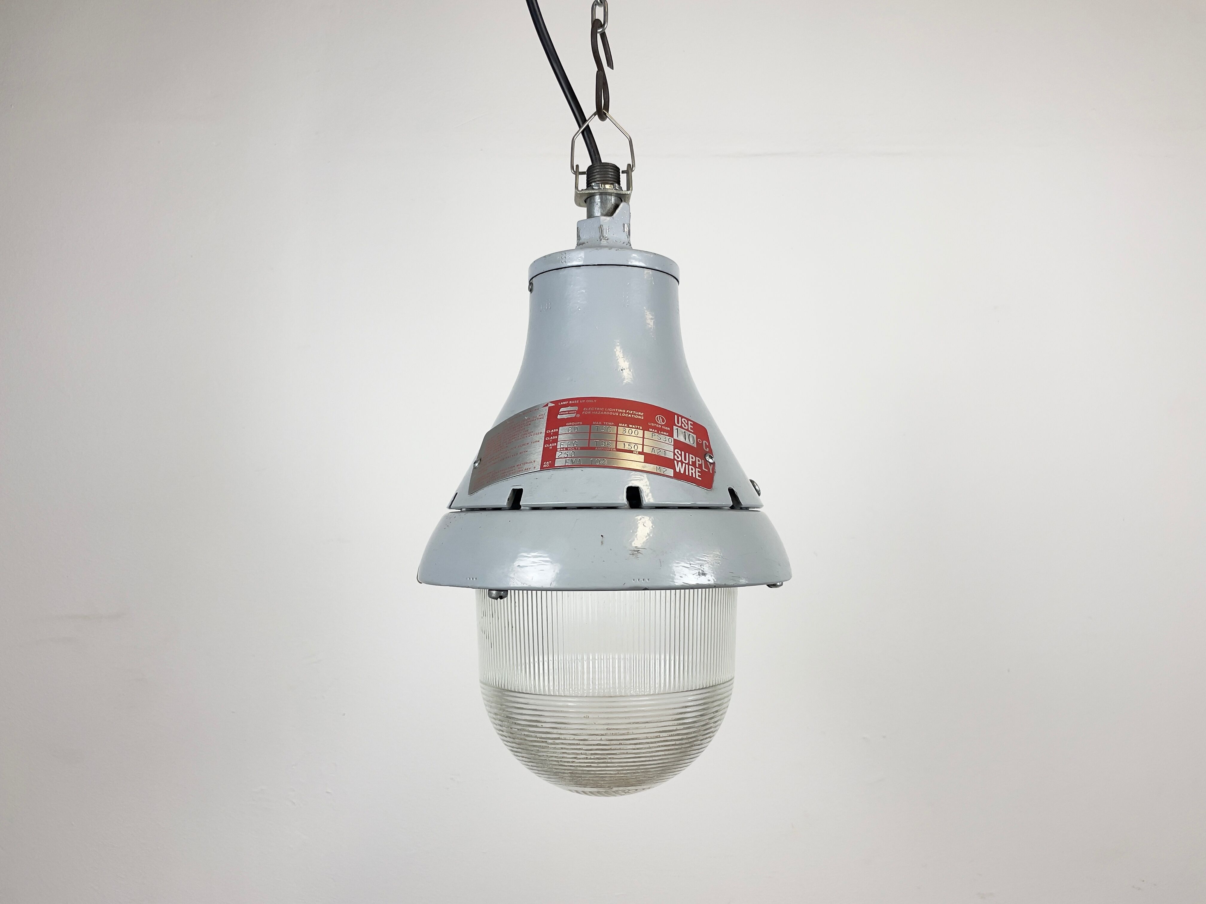 Grey industrial explosion proof light from Crouse-Hinds, 1970s
