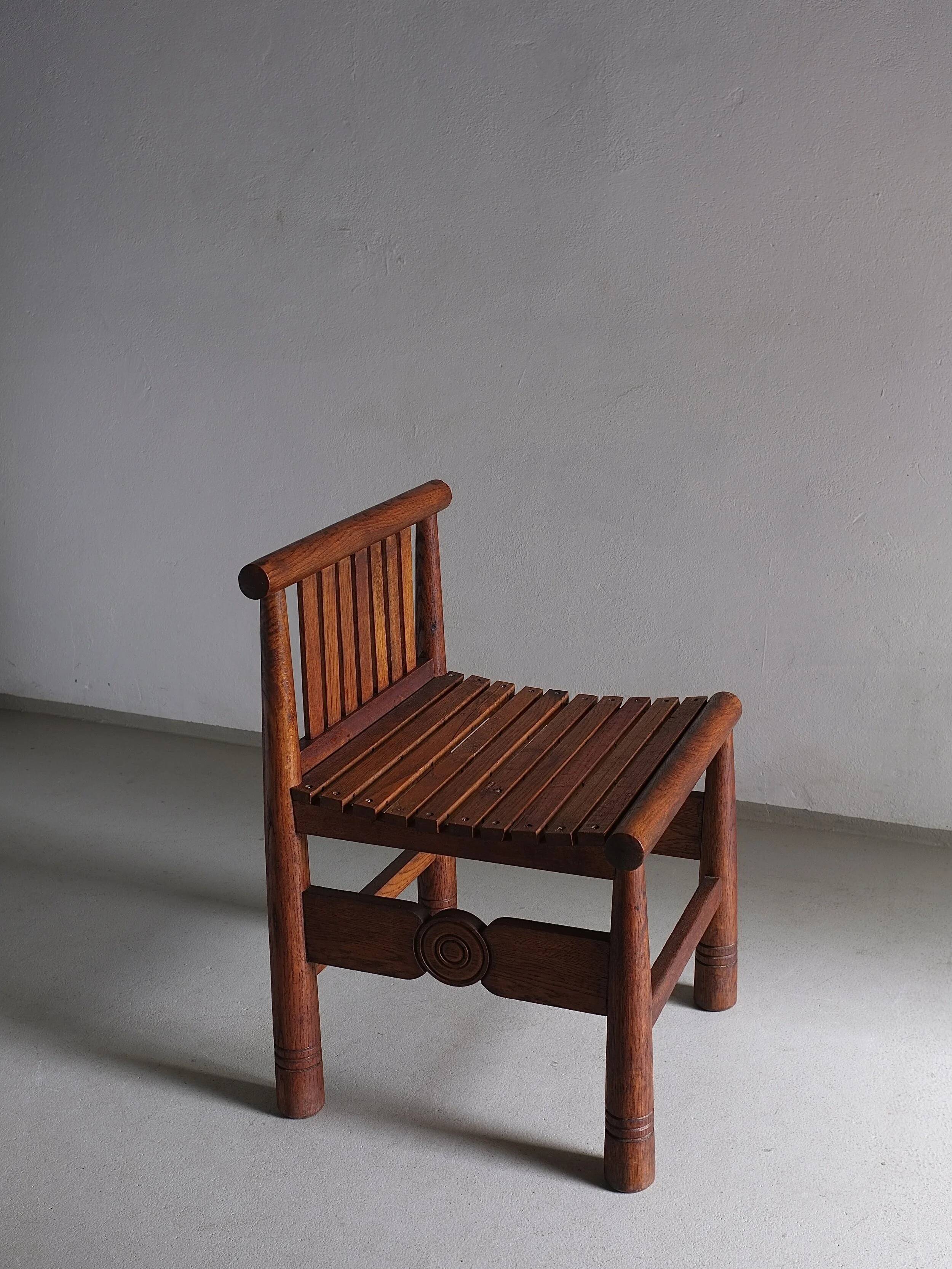 Carved oak low back chair | France | 1960s
