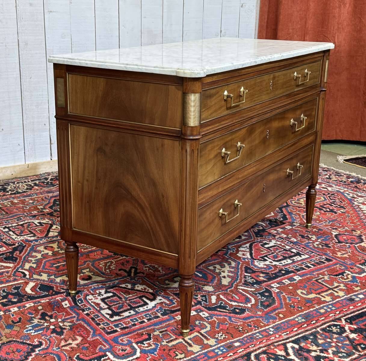 Louis XVI commode in mahogany with a marble top from the 1950s.