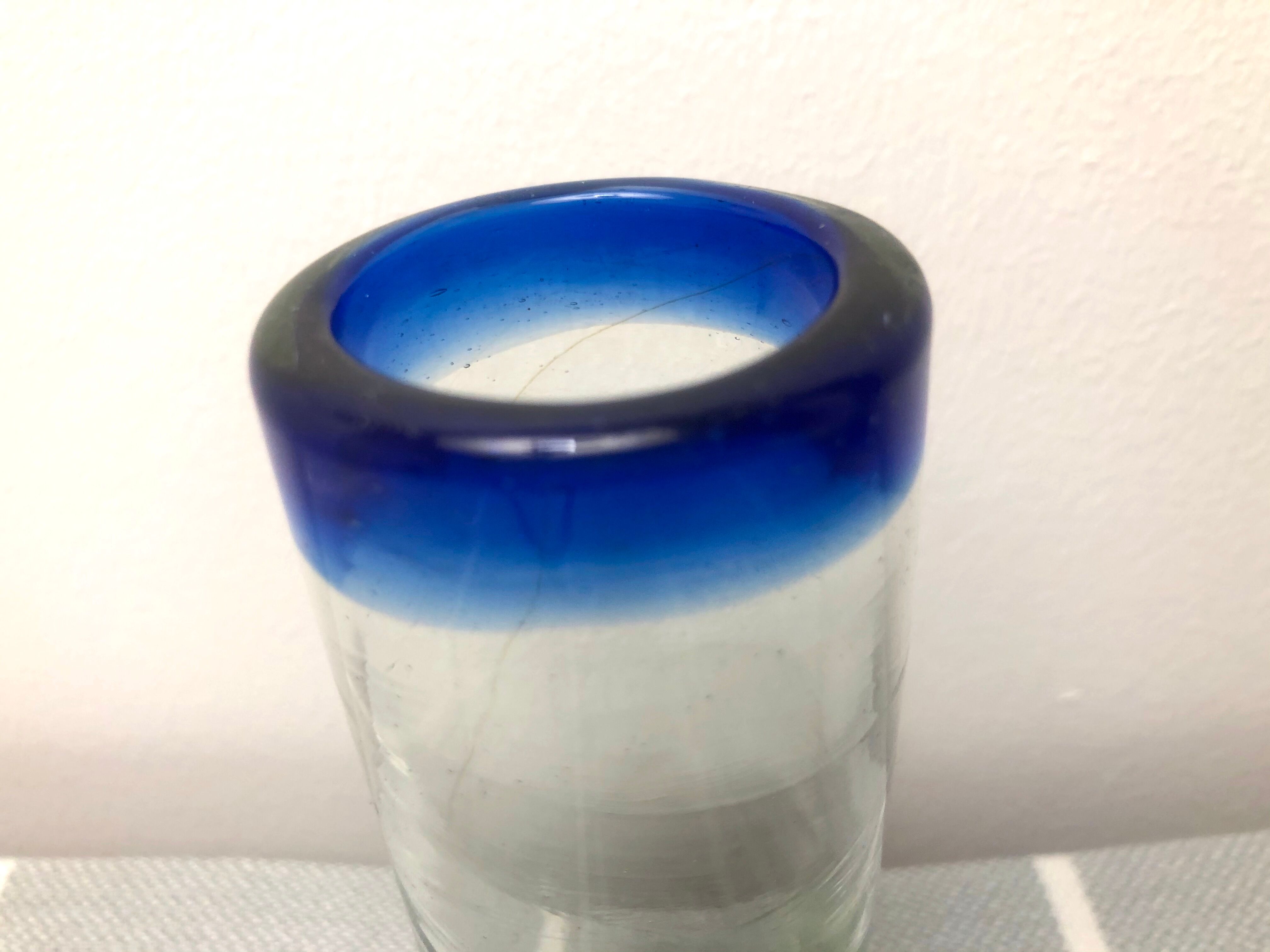 Handmade cobalt blue tequila glasses made of recycled glass