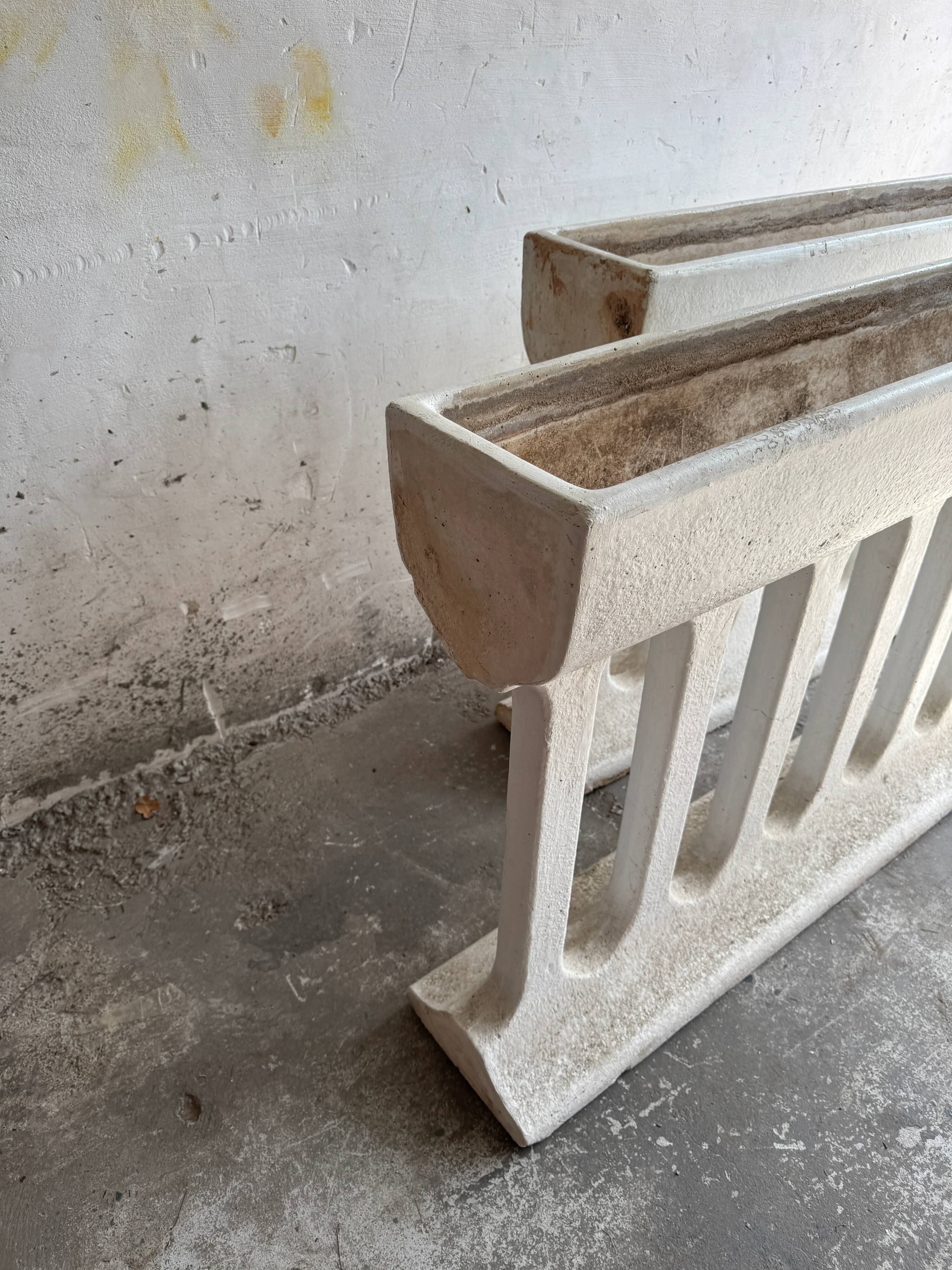 Pair of sculptural cast concrete planters in Off-White, mid-century brutalist style, long and rectangular.